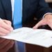 Legea ce îi scapă pe evazioniștii care plătesc prejudiciul și 15% în plus a fost promulgată