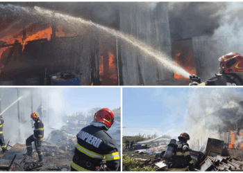 Incendiu la un atelier auto, stins după o intervenție dificilă! Flăcările amenințau locuințele din apropiere