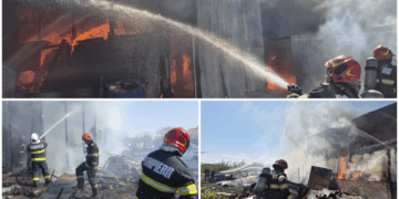 Incendiu la un atelier auto, stins după o intervenție dificilă! Flăcările amenințau locuințele din apropiere